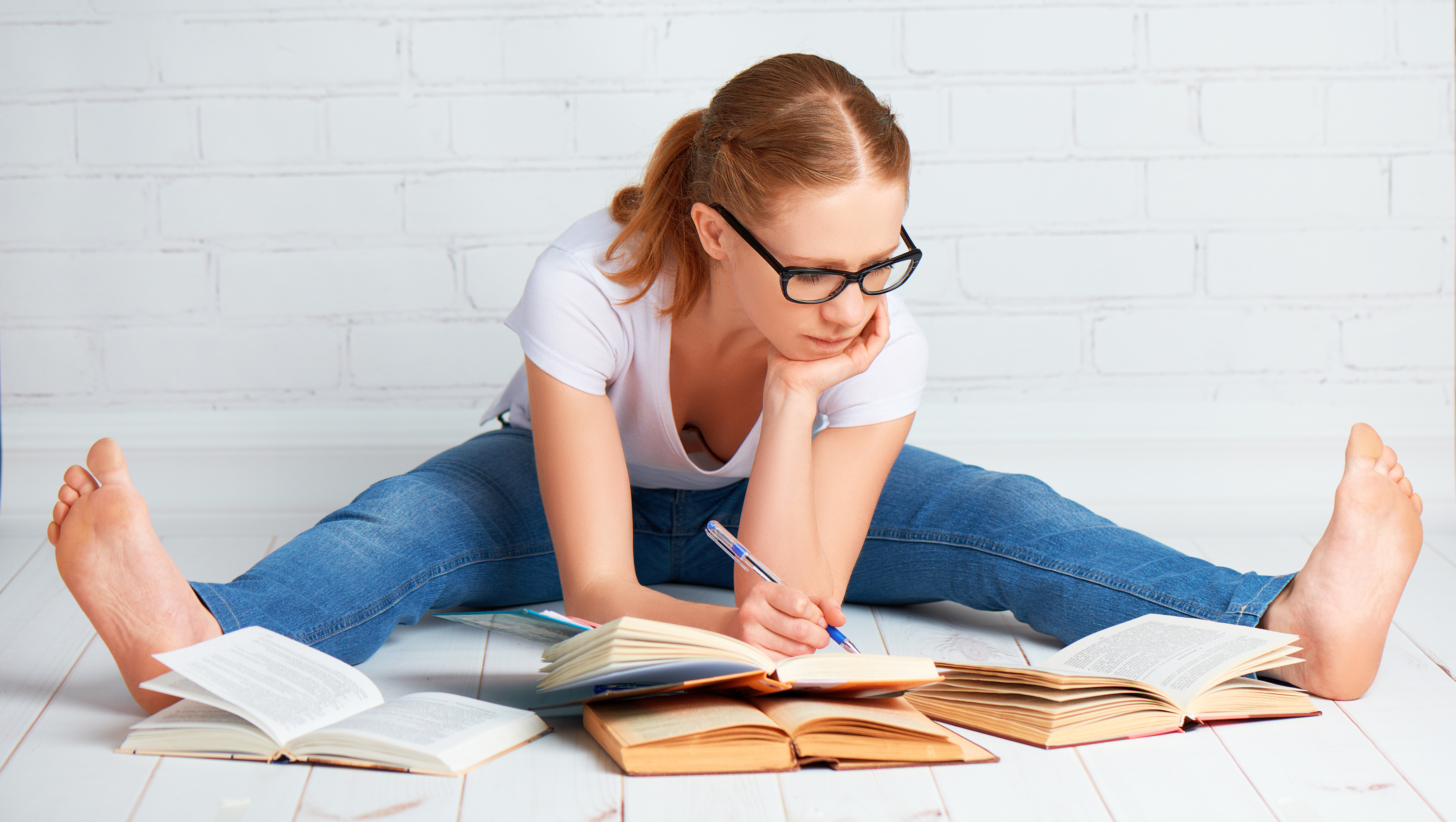 happy-girl-student-preparing-homework-preparing-for-the-exam-with